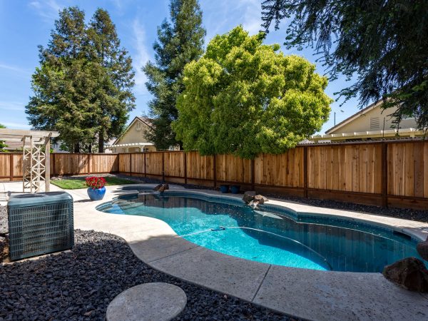 Exterior Backyard with Pool and Hot Tub in a neighborhood